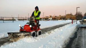 Worker+Operating+a+Snowrator+Clearing+Snow